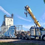 crane placing Heavy load onto truck