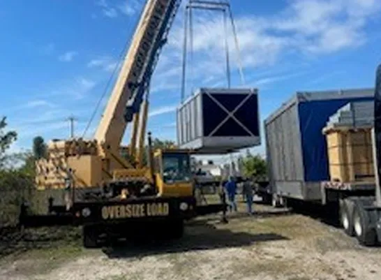 crane moving heavy cargo in storage yard